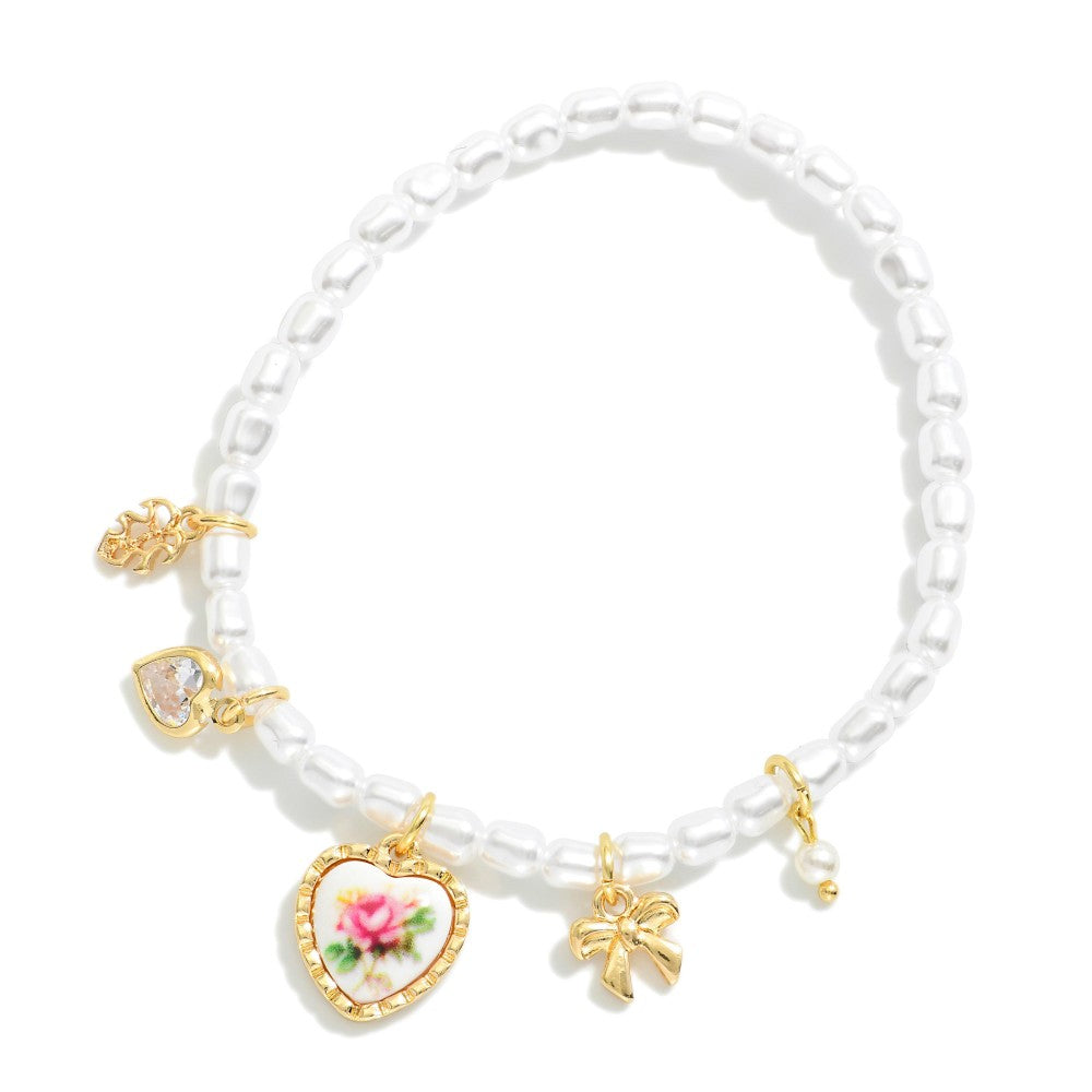 Pearl Beaded Stretch Bracelet Featuring Vintage Porcelain Pink Rose Heart Charm, Bow, Rhinestone Heart, And Leaf Charms
