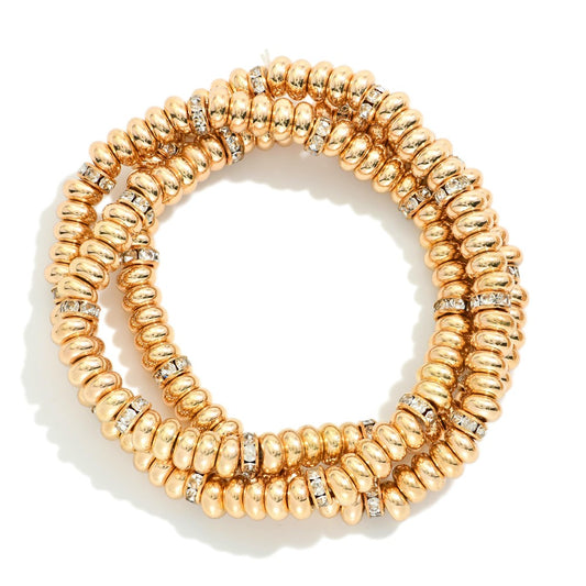 Set Of Three Metal Tone Disk Bead Stretch Bracelets Featuring Rhinestone Details