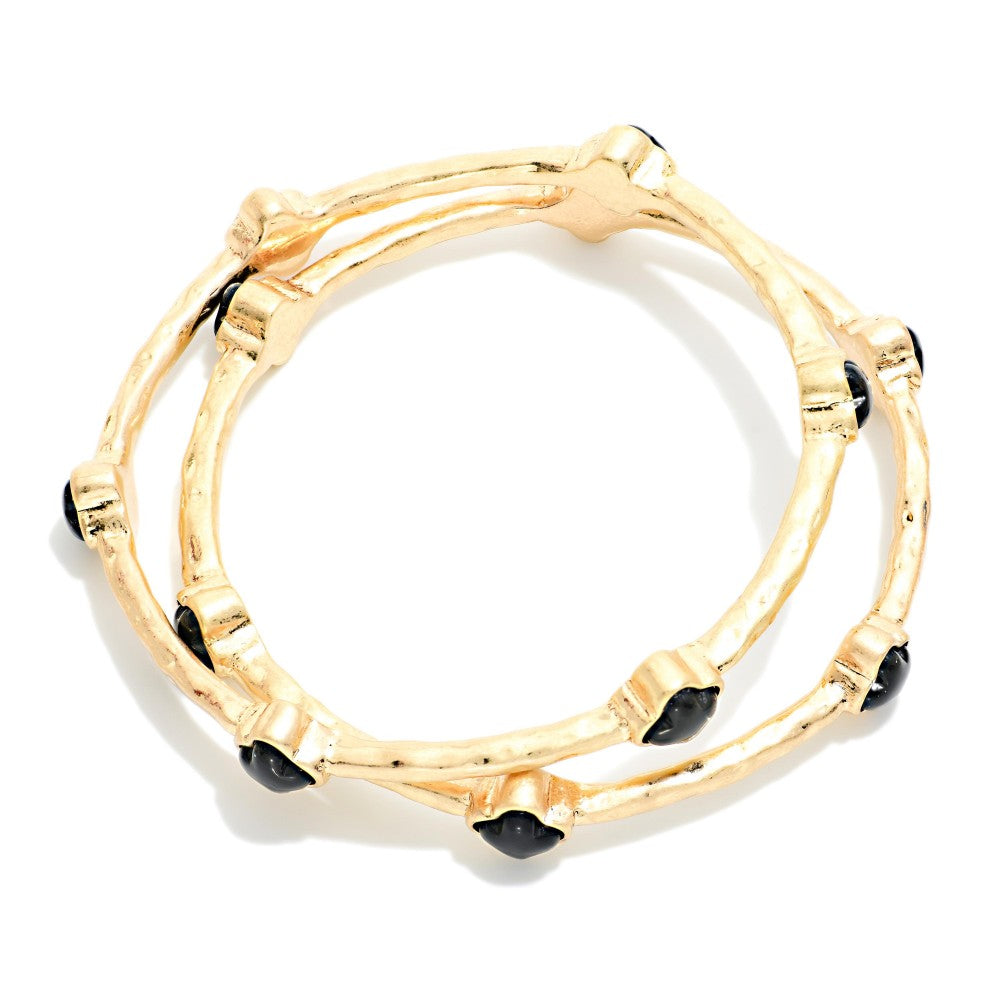 Set Of Two Hammered Metal Tone Bangle Bracelet Featuring Glitter Resin Clover - Black