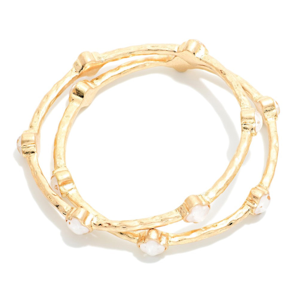 Set Of Two Hammered Metal Tone Bangle Bracelet Featuring Glitter Resin Clover - White