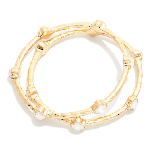 Set Of Two Hammered Metal Tone Bangle Bracelet Featuring Glitter Resin Clover - White